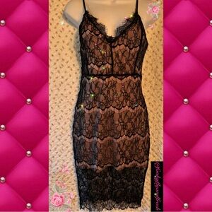 Nordstrom/Angl size small black lace and nude lining. Above the knee zip back